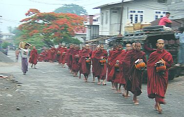 Each morning, monks collect food from the villagers