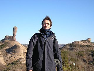 Fab in front of a strange stone