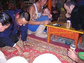 Evening activities in the ger: chess and knuckle-bones