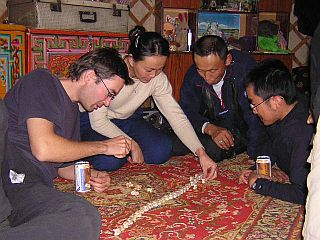 Evening activities in the ger: chess and knuckle-bones