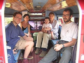 The family in a pick-up taxi